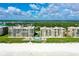 Aerial view of beachfront condominiums with a pool and lush landscaping at 4545 S Atlantic Ave # 3206, Port Orange, FL 32127
