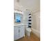 Bathroom featuring a modern vanity, toilet, and a blue-striped shower curtain at 4545 S Atlantic Ave # 3206, Port Orange, FL 32127