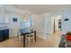Bright dining area with hardwood floors, stylish lighting, and seating for four at 4545 S Atlantic Ave # 3206, Port Orange, FL 32127