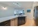 Modern kitchen with stainless steel appliances, sleek countertops, and ample cabinetry at 4545 S Atlantic Ave # 3206, Port Orange, FL 32127