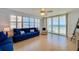 This beautiful living room has a ceiling fan and sliding doors with ocean views at 4545 S Atlantic Ave # 3206, Port Orange, FL 32127