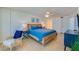 Relaxing bedroom with a king bed, ceiling fan, and an abundance of natural light at 4545 S Atlantic Ave # 3206, Port Orange, FL 32127