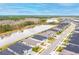 Aerial view highlighting the waterfront properties, landscaped yards and overall neighborhood layout at 604 Mosaic Blvd, Daytona Beach, FL 32124
