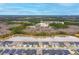 Aerial view of a neighborhood featuring water views and lush greenery, highlighting community charm at 604 Mosaic Blvd, Daytona Beach, FL 32124
