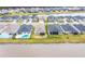 Aerial view of lakefront homes with pools and well-kept yards, showcasing an upscale community at 604 Mosaic Blvd, Daytona Beach, FL 32124