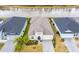Beautiful single-Gathering home overlooking a pond and manicured landscaping on a sunny day at 604 Mosaic Blvd, Daytona Beach, FL 32124