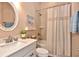 Bright bathroom with a tub-shower combo and neutral decor at 604 Mosaic Blvd, Daytona Beach, FL 32124