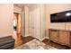 Bedroom featuring neutral walls, a TV, and a glimpse into adjacent rooms at 604 Mosaic Blvd, Daytona Beach, FL 32124
