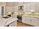 Spacious kitchen with modern appliances, elegant countertops, ample cabinetry, and a stylish vent hood at 604 Mosaic Blvd, Daytona Beach, FL 32124