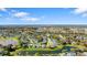 Wide aerial view of the community, showcasing lakes, trees, and homes at 6123 Jasmine Vine Dr, Port Orange, FL 32128
