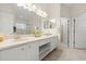 Bright bathroom with double vanity, white cabinetry, and a separate shower at 6123 Jasmine Vine Dr, Port Orange, FL 32128