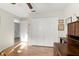 Bedroom featuring hardwood floors, closet, and door at 6123 Jasmine Vine Dr, Port Orange, FL 32128