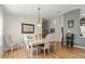 The dining room offers lots of natural light and wood floors at 6123 Jasmine Vine Dr, Port Orange, FL 32128
