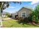 Charming single-story home with a well-manicured lawn and a two-car garage at 6123 Jasmine Vine Dr, Port Orange, FL 32128