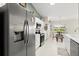 Modern kitchen with stainless steel refrigerator and a view of the breakfast nook and backyard at 6123 Jasmine Vine Dr, Port Orange, FL 32128