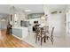 Bright, airy kitchen featuring a breakfast nook with a backyard view at 6123 Jasmine Vine Dr, Port Orange, FL 32128