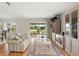 Spacious living room showcasing hardwood floors, backyard views, and built-in shelving at 6123 Jasmine Vine Dr, Port Orange, FL 32128