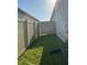 Small backyard with a fence and gate offering security and privacy at 137 Eagle Harbor Way, Daytona Beach, FL 32124