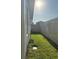 Backyard with green grass and perimeter fence for added privacy at 137 Eagle Harbor Way, Daytona Beach, FL 32124