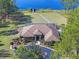 Aerial view of house showing the front entrance and garden area at 22527 Lake Seneca Rd, Eustis, FL 32736