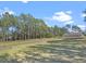 Stunning aerial view showcasing expansive property with private lake access and lush surroundings at 22527 Lake Seneca Rd, Eustis, FL 32736