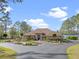 Stunning single-story home features a circular driveway with lush landscaping and picturesque lake views at 22527 Lake Seneca Rd, Eustis, FL 32736