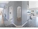 Hallway view showcasing stylish tile floors and access to various rooms in the home at 22527 Lake Seneca Rd, Eustis, FL 32736