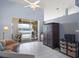 Inviting living room with tile floors, ceiling fan, and sliders leading to a screened-in porch and pool area at 22527 Lake Seneca Rd, Eustis, FL 32736