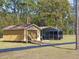 A utility building with garage door and covered parking at 22527 Lake Seneca Rd, Eustis, FL 32736