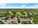 Aerial view of a golf course and community, showcasing the neighborhood's landscape at 3428 Rexford Cir, Ormond Beach, FL 32174