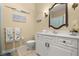 Bathroom with a single vanity, an elegant mirror, white fixtures, and coastal decorations at 3428 Rexford Cir, Ormond Beach, FL 32174