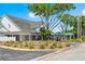 Well-maintained community building featuring a covered entrance and manicured landscaping at 3428 Rexford Cir, Ormond Beach, FL 32174