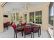Covered lanai offers a comfortable spot for dining and relaxing, with views of the outdoor surroundings at 3428 Rexford Cir, Ormond Beach, FL 32174