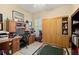 Home office offering a built-in desk, ample storage, and a comfortable workspace for remote work or study at 3428 Rexford Cir, Ormond Beach, FL 32174