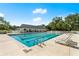 Community pool with ample lounge chairs for relaxing poolside at 3428 Rexford Cir, Ormond Beach, FL 32174