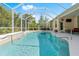 Inviting swimming pool with a screened enclosure and easy access steps, perfect for a refreshing dip at 3428 Rexford Cir, Ormond Beach, FL 32174