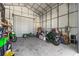The expansive workshop provides ample room for projects and organization, illuminated by natural light at 318 Eastwood Dr, Daytona Beach, FL 32118