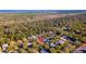 Aerial view of a residential area surrounded by mature trees, showcasing the property's peaceful location at 3220 Galty Cir, Ormond Beach, FL 32174