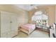 This bedroom has warm, inviting paint and a cozy feel, complete with large window at 3220 Galty Cir, Ormond Beach, FL 32174