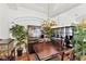 Dining room with a wooden table, chandelier, and decorative plants, creating a warm and inviting atmosphere. Move in ready! at 3220 Galty Cir, Ormond Beach, FL 32174