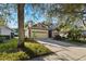 Inviting home with a well-maintained lawn, mature landscaping, and a two-car garage at 3220 Galty Cir, Ormond Beach, FL 32174