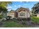 Charming single-story home with attached garage and well-manicured front yard landscaping at 3220 Galty Cir, Ormond Beach, FL 32174