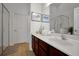 Bathroom featuring long vanity with white sink and tiled floor at 410 Viola Dr, Davenport, FL 33837