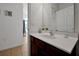 Bathroom featuring a wood vanity, white sink, neutral walls, and tiled floor at 410 Viola Dr, Davenport, FL 33837