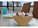 Close up of an outdoor set table with dishes and a decorative bowl at 410 Viola Dr, Davenport, FL 33837