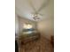 Cozy bedroom with vaulted ceiling, ceiling fan, and natural light at 105 Cattail Ct, Kissimmee, FL 34743