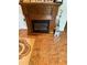 A traditional wooden fireplace mantel with electric fireplace insert at 105 Cattail Ct, Kissimmee, FL 34743
