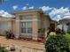 Charming home with meticulously landscaped front yard and an inviting entrance at 105 Cattail Ct, Kissimmee, FL 34743