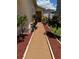 Manicured front walkway with decorative landscaping leading to the entrance at 105 Cattail Ct, Kissimmee, FL 34743