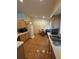 Spacious eat-in kitchen with tile flooring, a refrigerator, ample counter space, and a dining table at 105 Cattail Ct, Kissimmee, FL 34743